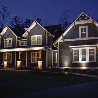Professional outdoor lighting on this Mason home added beauty and security after dark. Photo